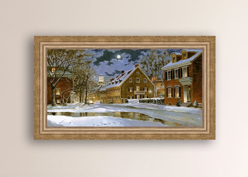 Snowy Bethlehem scene with Moravian Church at night.