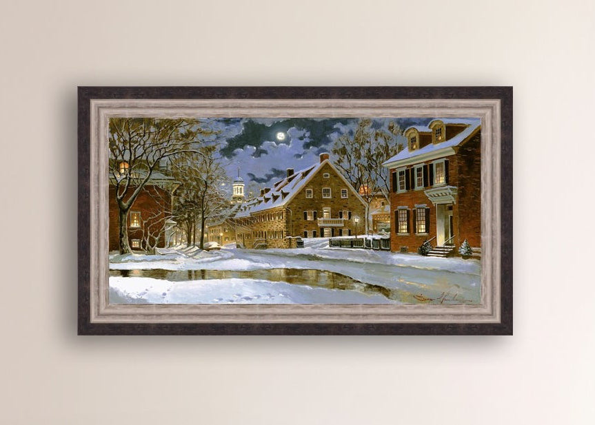 Snowy Bethlehem scene with Moravian Church at night.