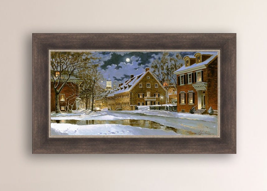 Snowy Bethlehem scene with Moravian Church at night.