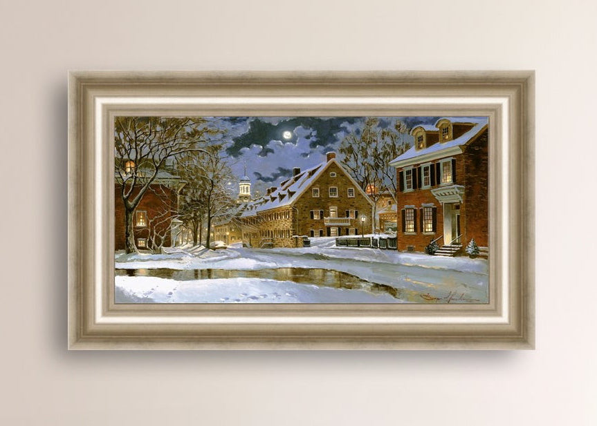 Snowy Bethlehem scene with Moravian Church at night.