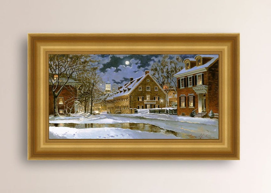 Snowy Bethlehem scene with Moravian Church at night.