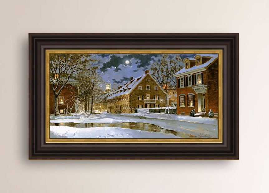 Snowy Bethlehem scene with Moravian Church at night.