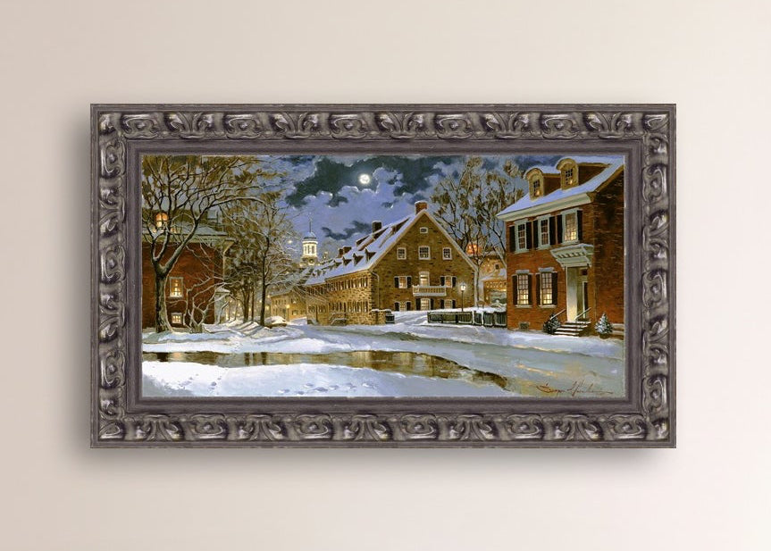 Snowy Bethlehem scene with Moravian Church at night.