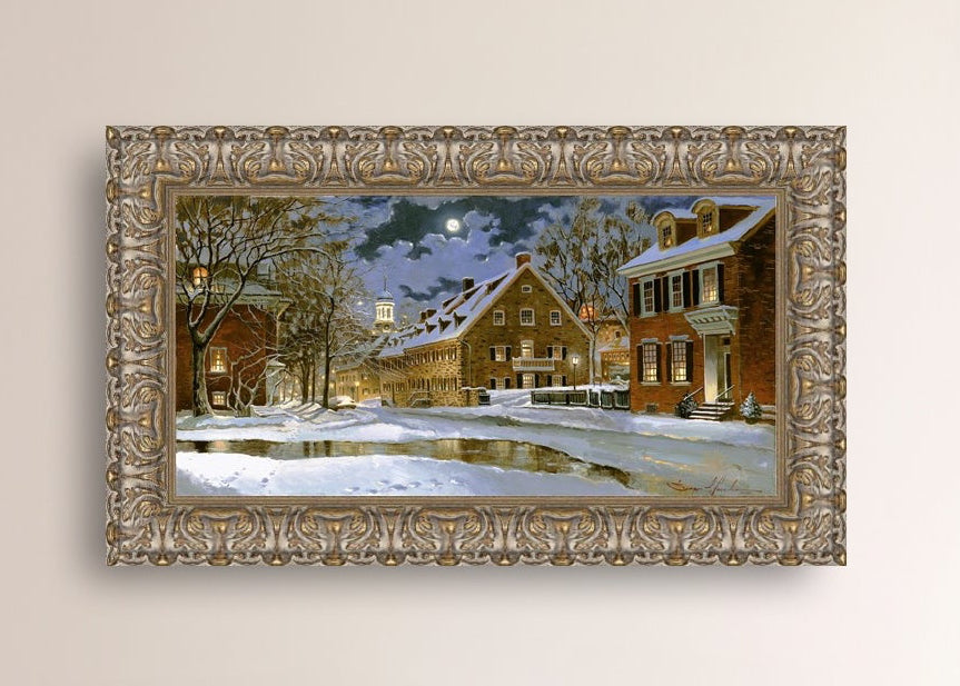 Snowy Bethlehem scene with Moravian Church at night.