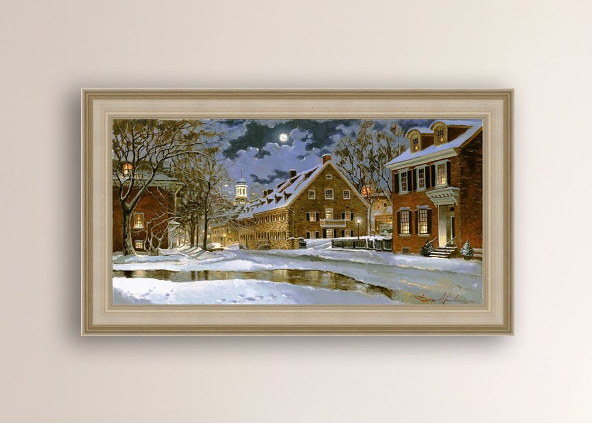 Snowy Bethlehem scene with Moravian Church at night.