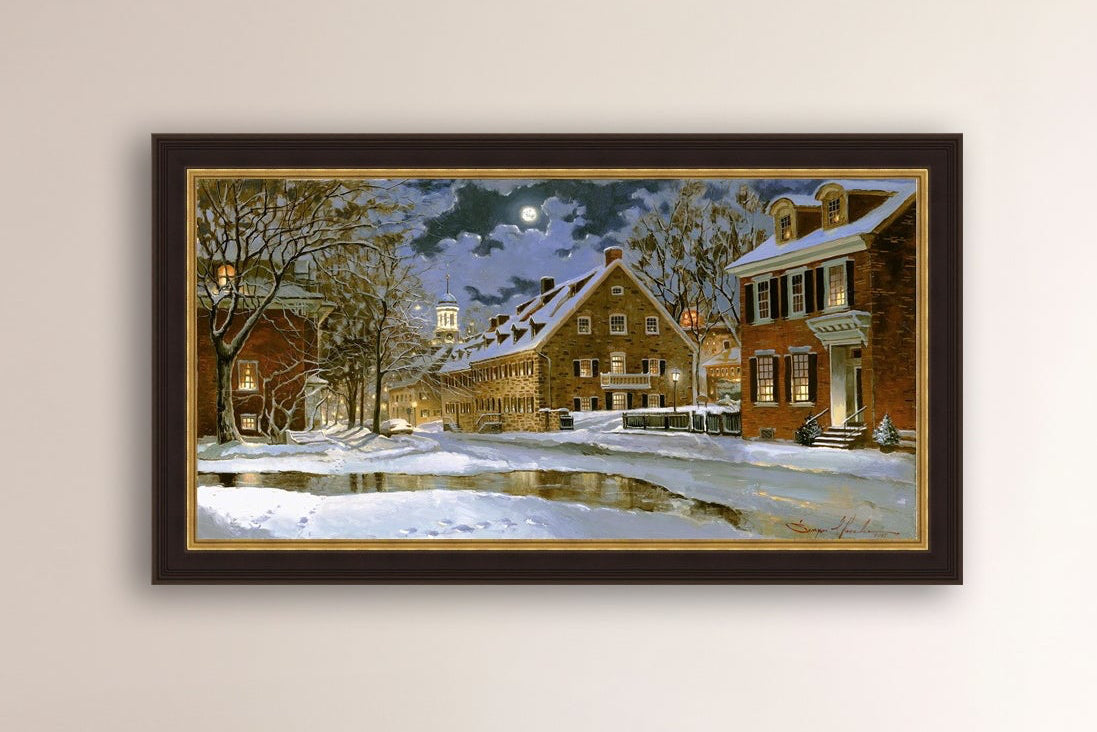 Snowy Bethlehem scene with Moravian Church at night.