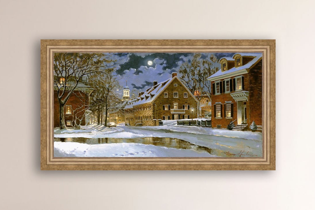 Snowy Bethlehem scene with Moravian Church at night.