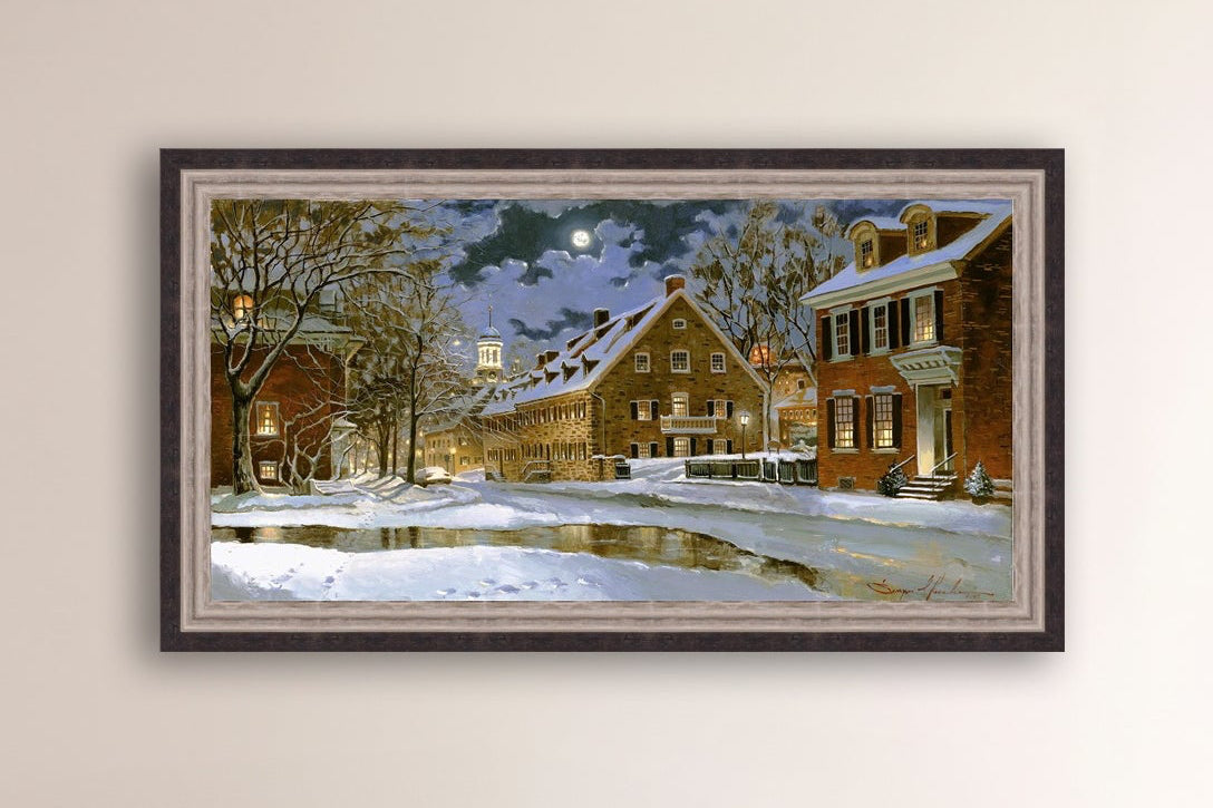 Snowy Bethlehem scene with Moravian Church at night.