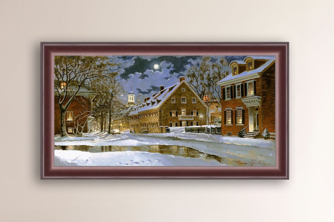 Snowy Bethlehem scene with Moravian Church at night.