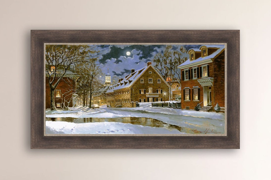 Snowy Bethlehem scene with Moravian Church at night.