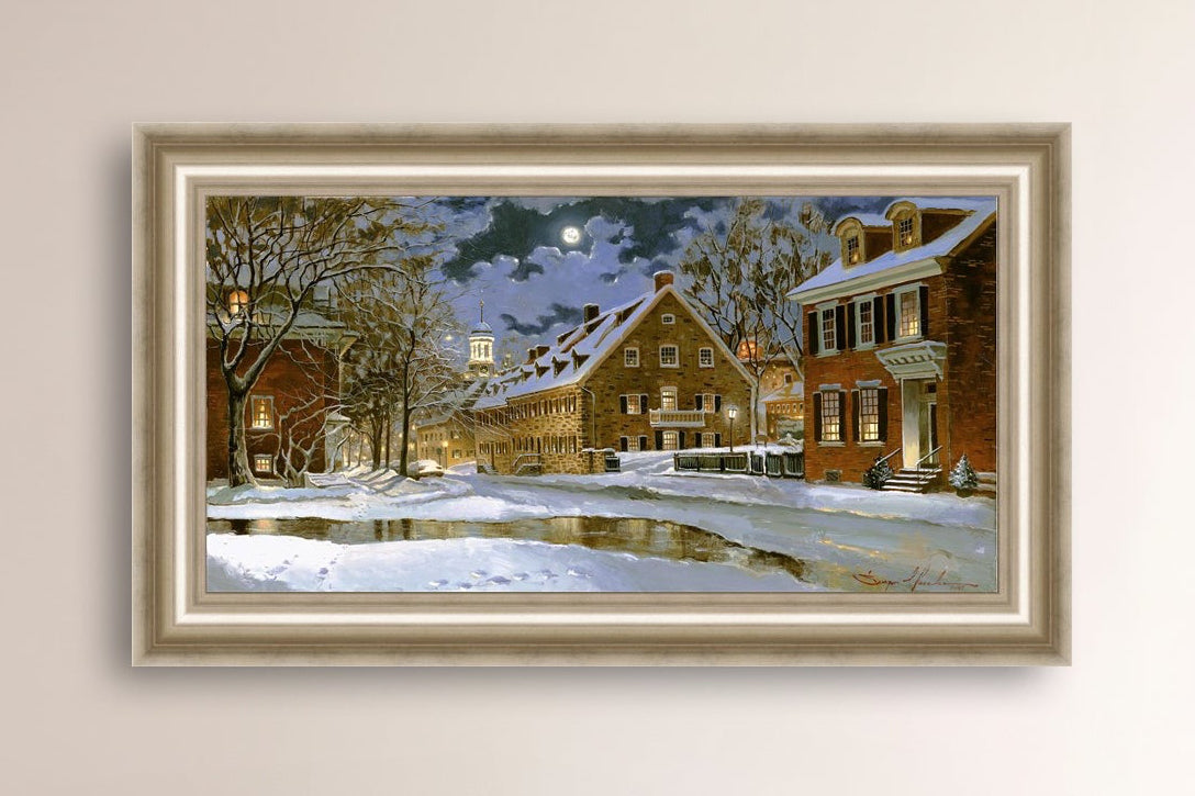 Snowy Bethlehem scene with Moravian Church at night.