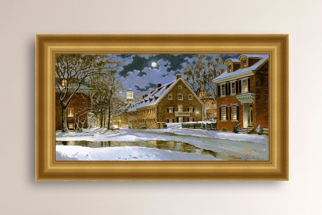 Snowy Bethlehem scene with Moravian Church at night.