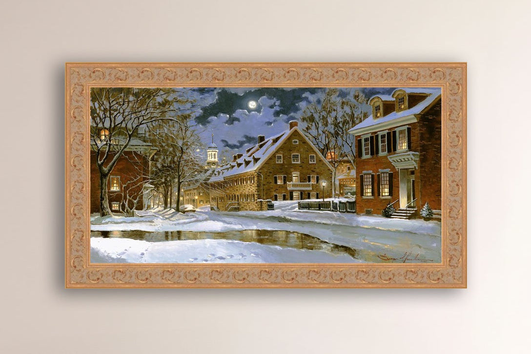 Snowy Bethlehem scene with Moravian Church at night.