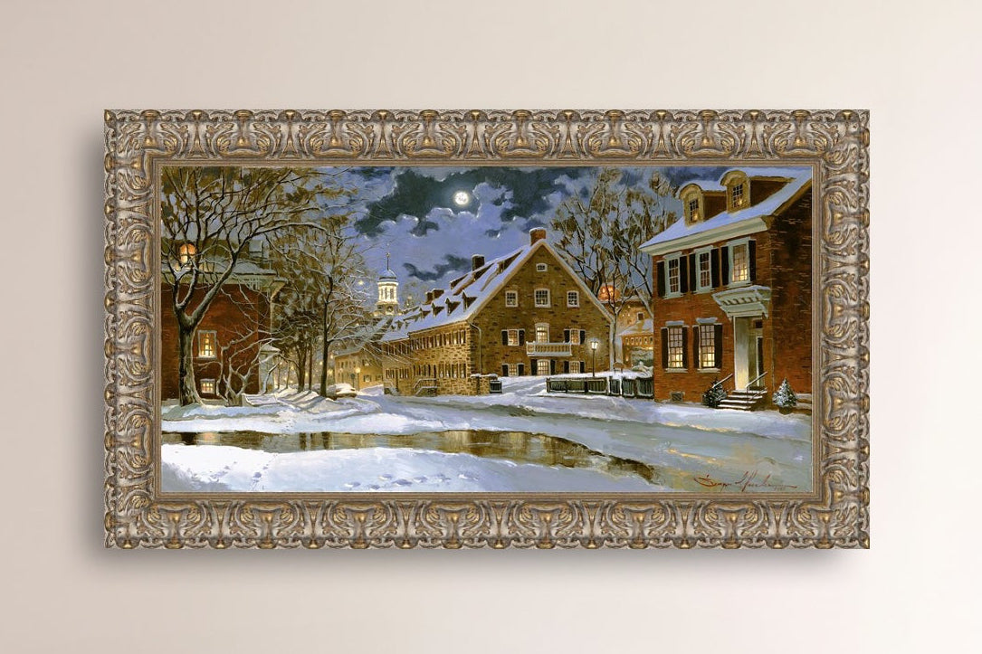 Snowy Bethlehem scene with Moravian Church at night.