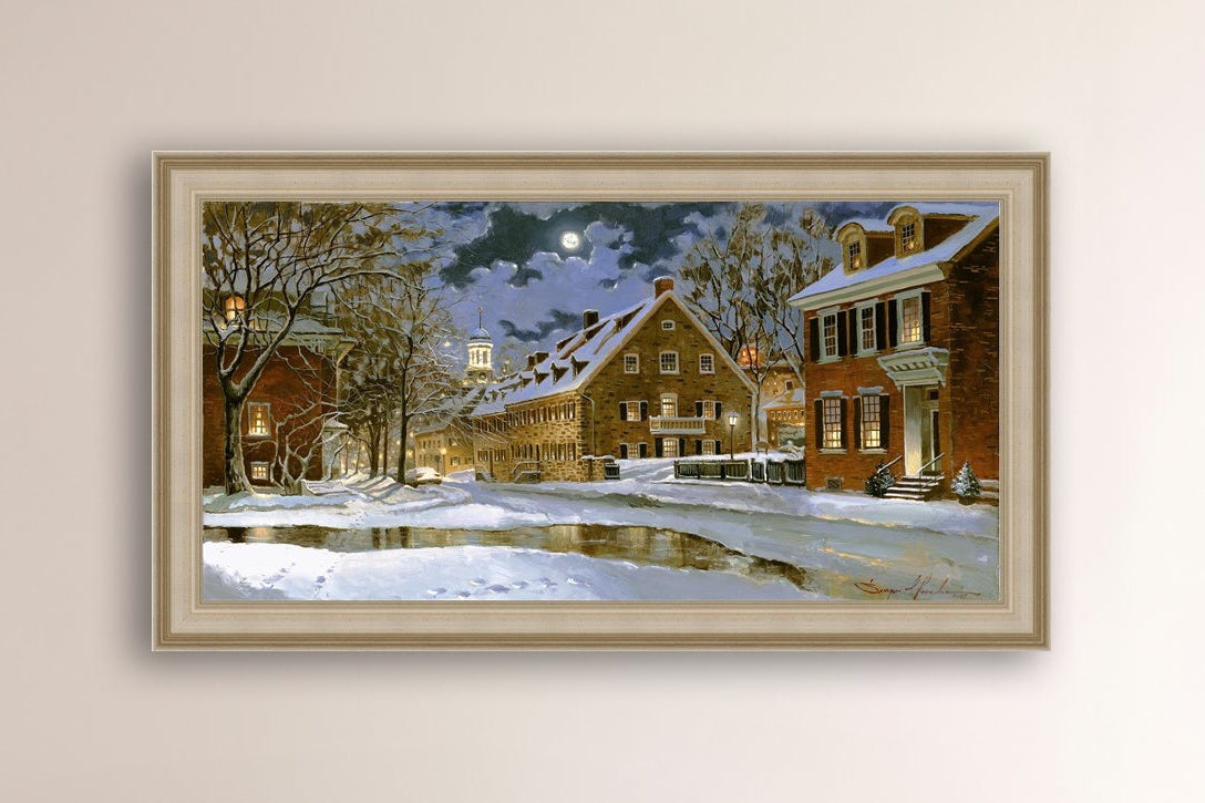 Snowy Bethlehem scene with Moravian Church at night.