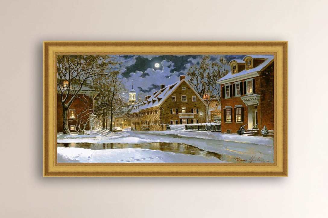 Snowy Bethlehem scene with Moravian Church at night.