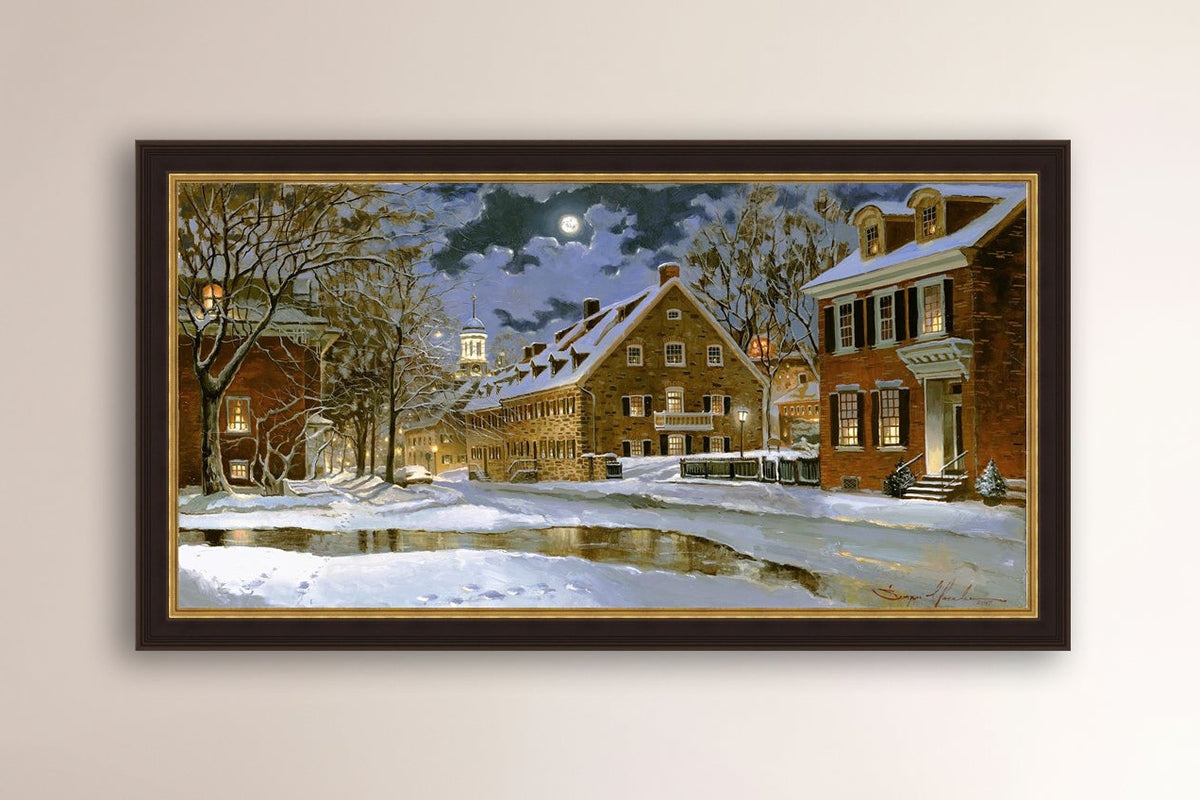 Snowy Bethlehem scene with Moravian Church at night.