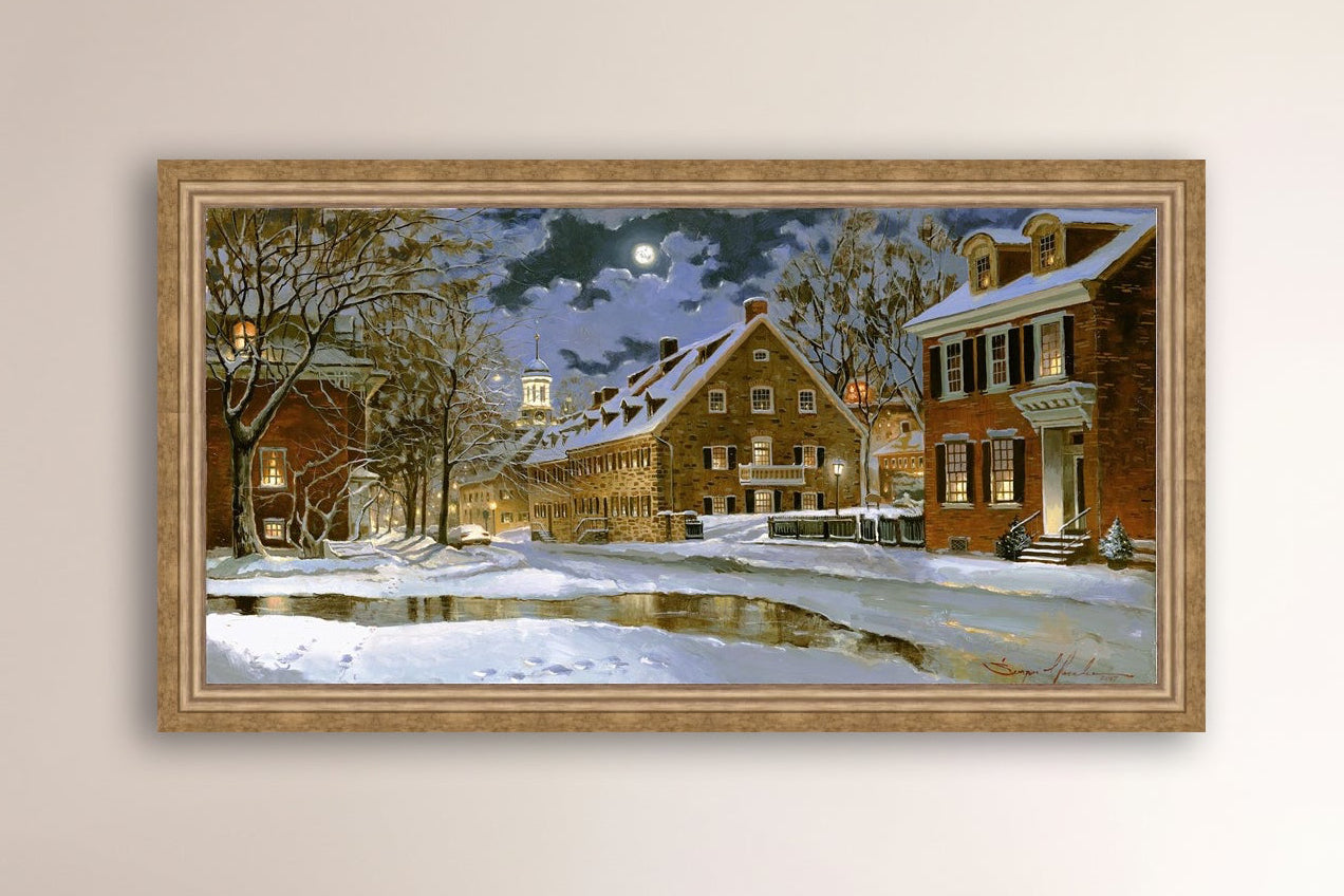 Snowy Bethlehem scene with Moravian Church at night.