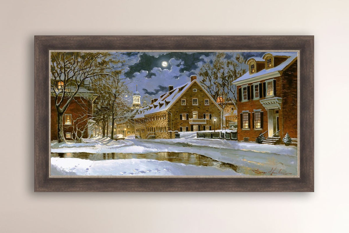 Snowy Bethlehem scene with Moravian Church at night.