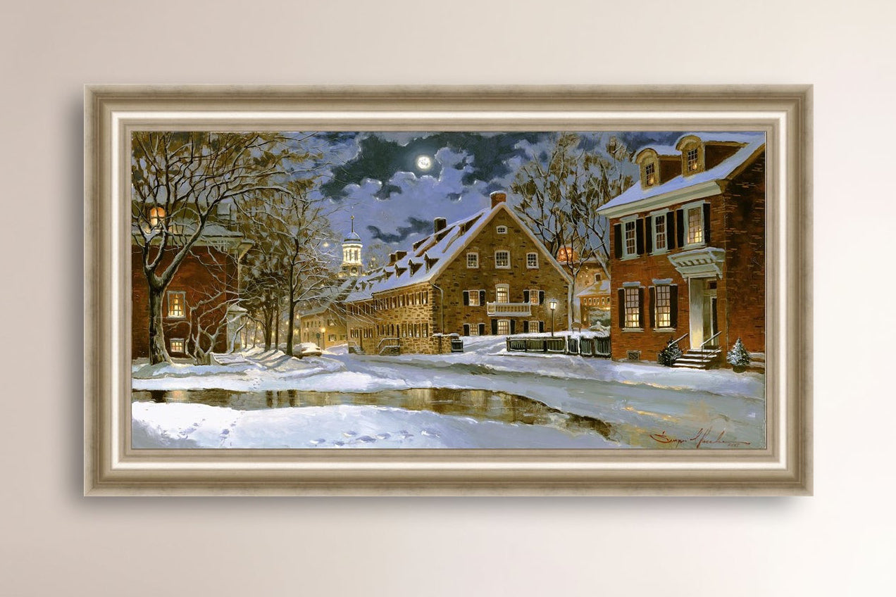 Snowy Bethlehem scene with Moravian Church at night.