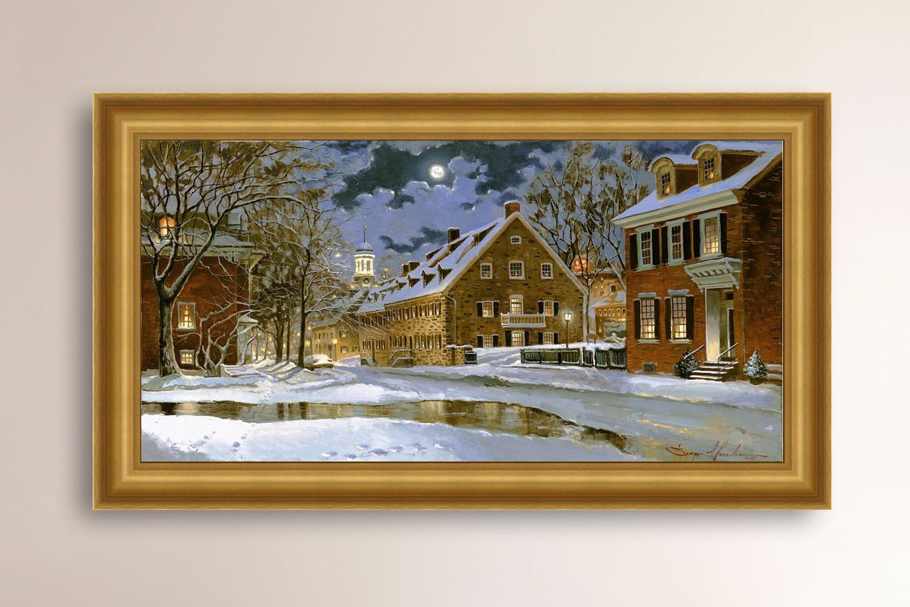 Snowy Bethlehem scene with Moravian Church at night.