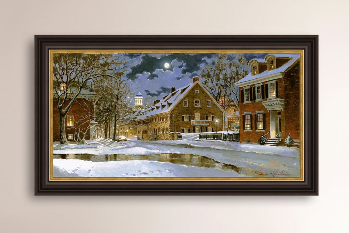 Snowy Bethlehem scene with Moravian Church at night.