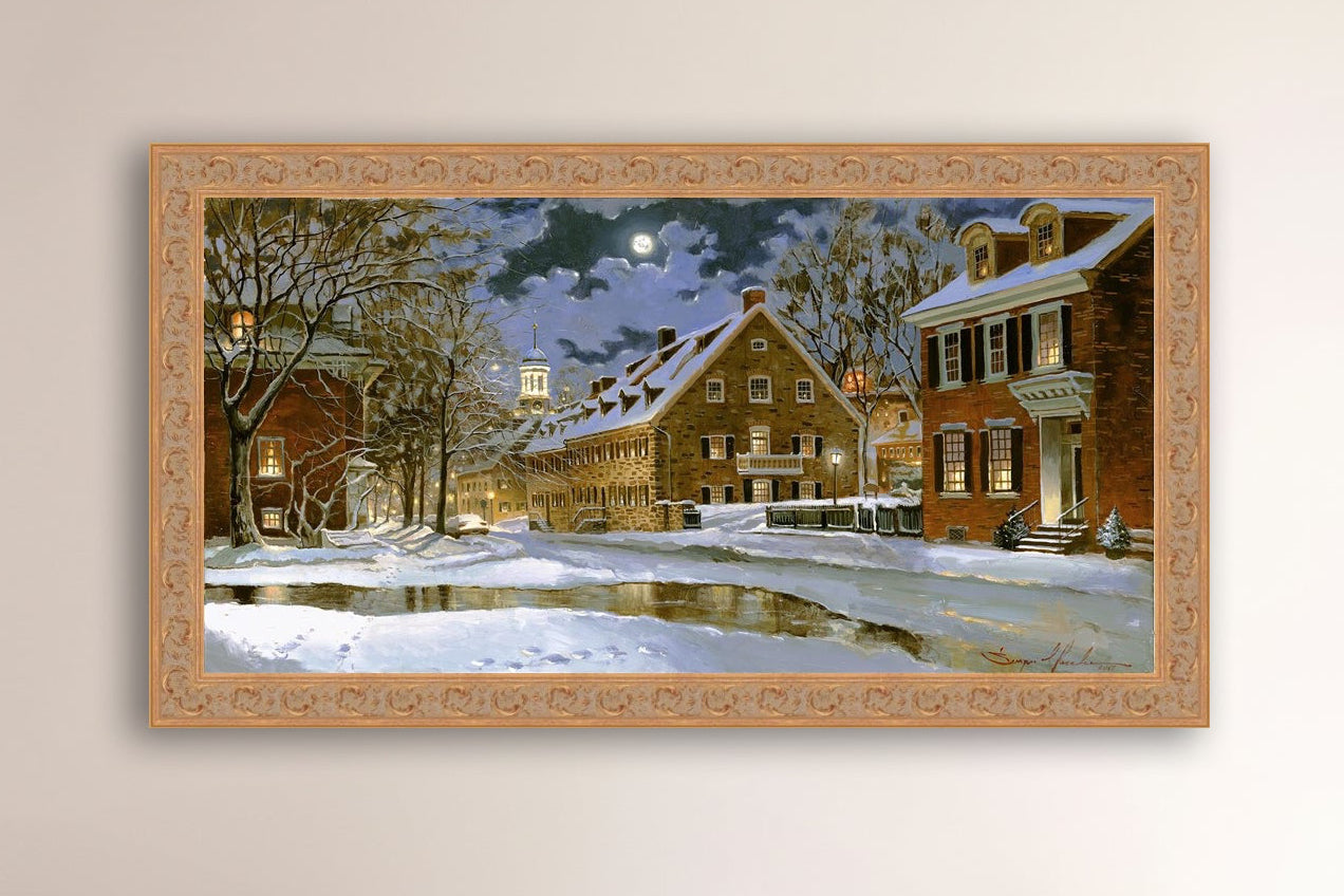 Snowy Bethlehem scene with Moravian Church at night.