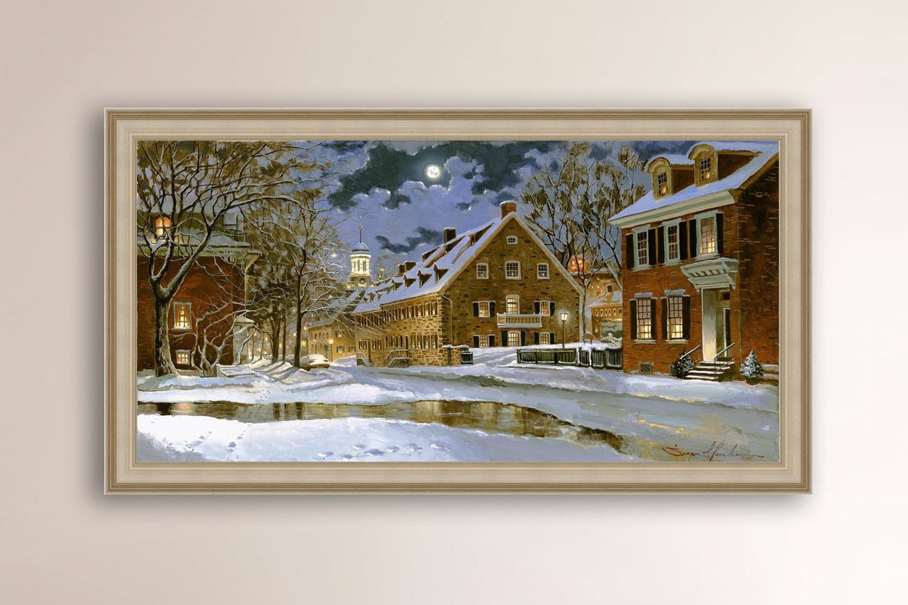 Snowy Bethlehem scene with Moravian Church at night.