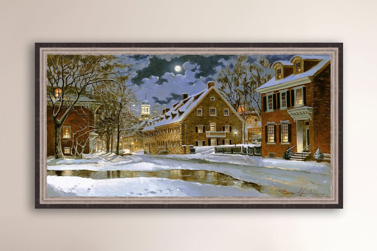 Snowy Bethlehem scene with Moravian Church at night.