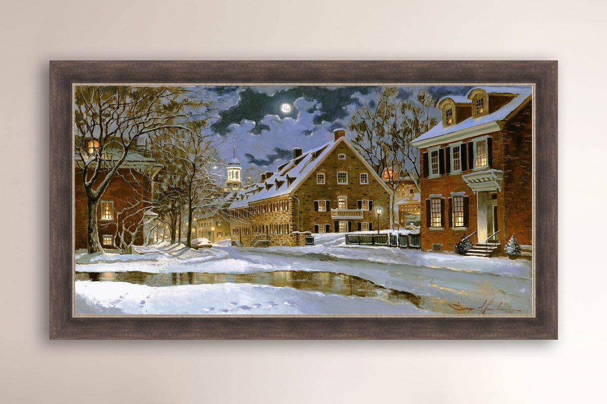 Snowy Bethlehem scene with Moravian Church at night.