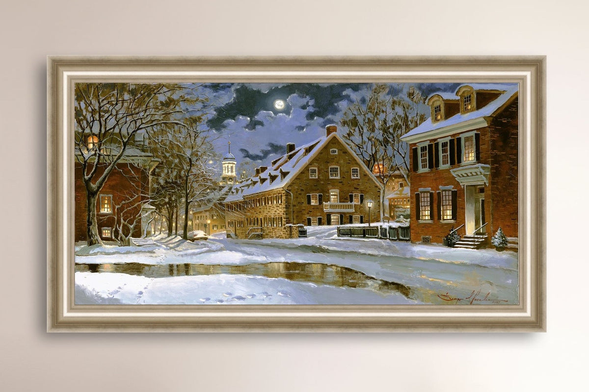 Snowy Bethlehem scene with Moravian Church at night.