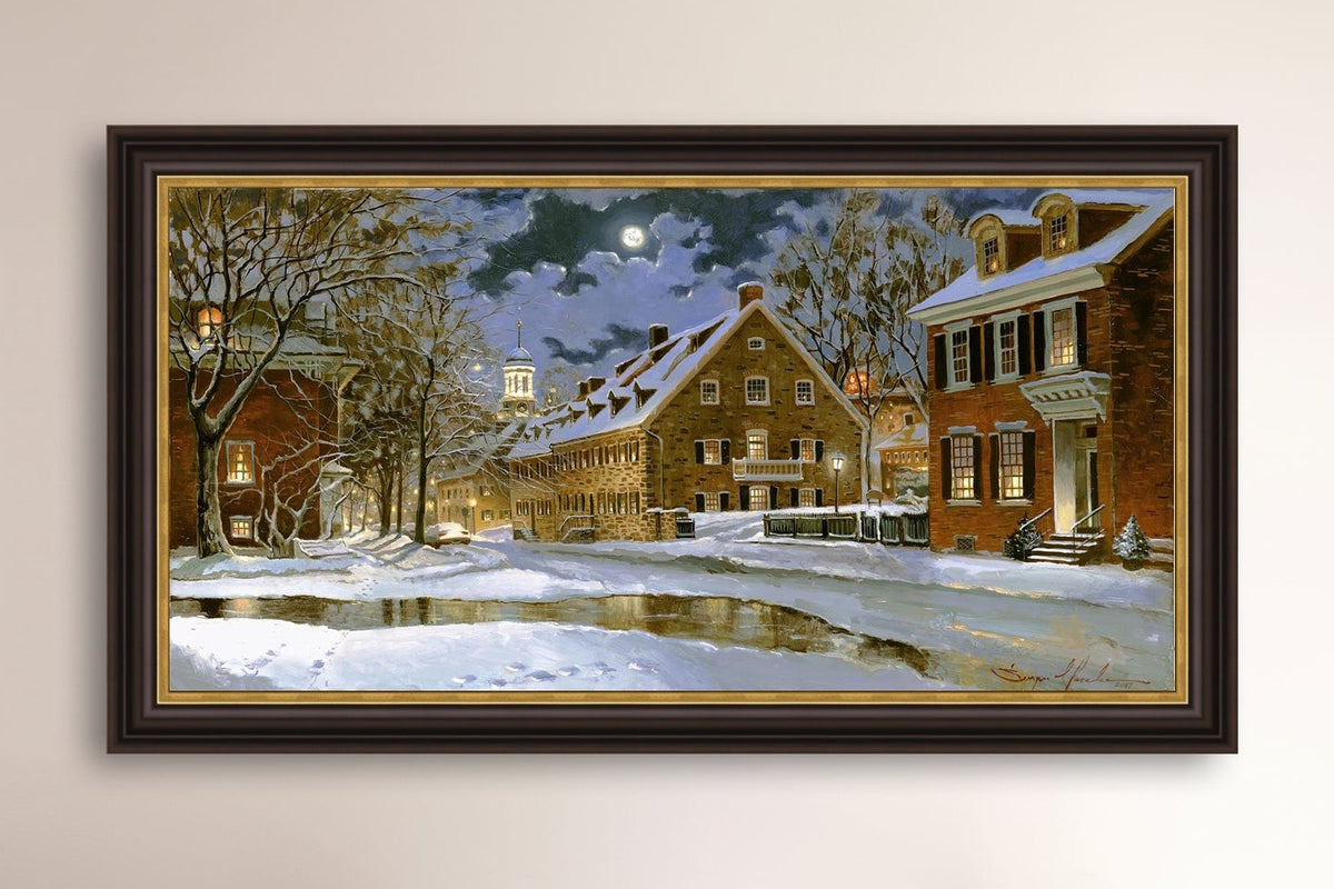 Snowy Bethlehem scene with Moravian Church at night.