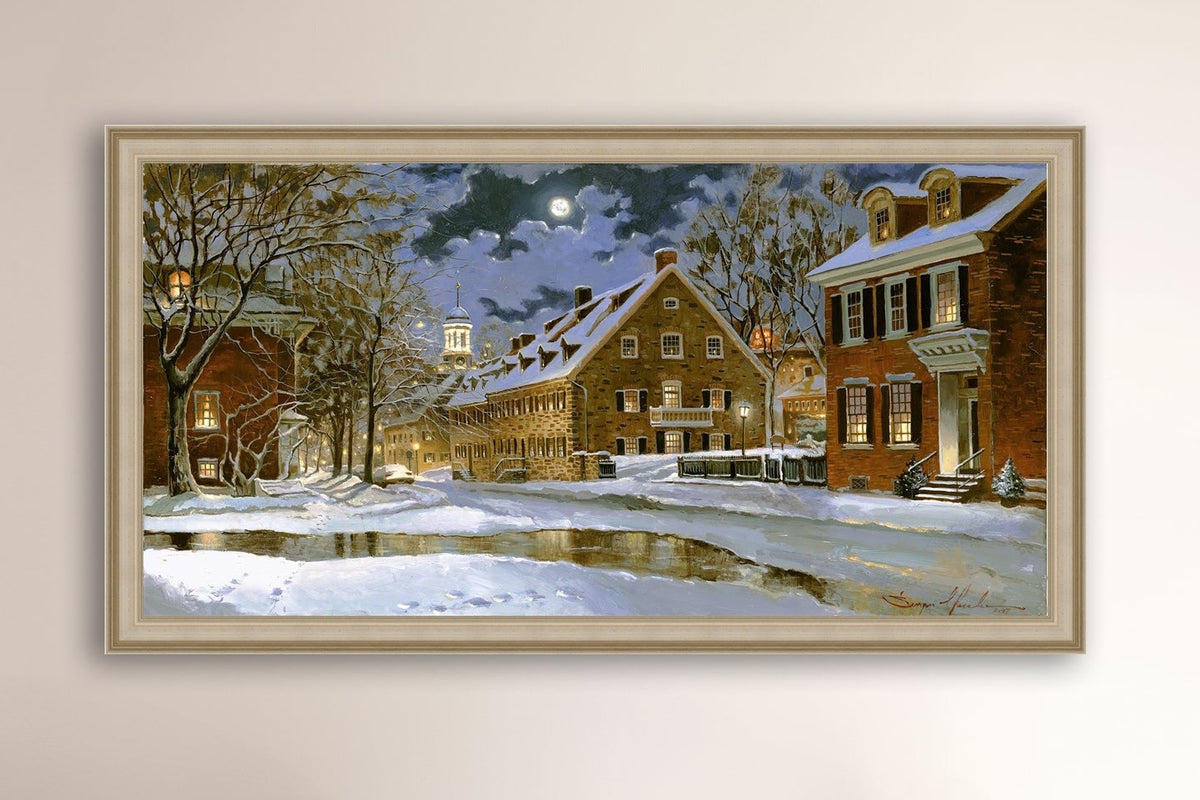 Snowy Bethlehem scene with Moravian Church at night.