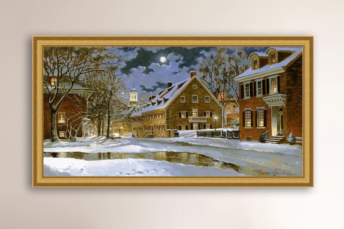 Snowy Bethlehem scene with Moravian Church at night.