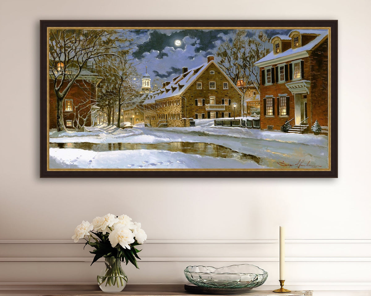 Snowy Bethlehem scene with Moravian Church at night.