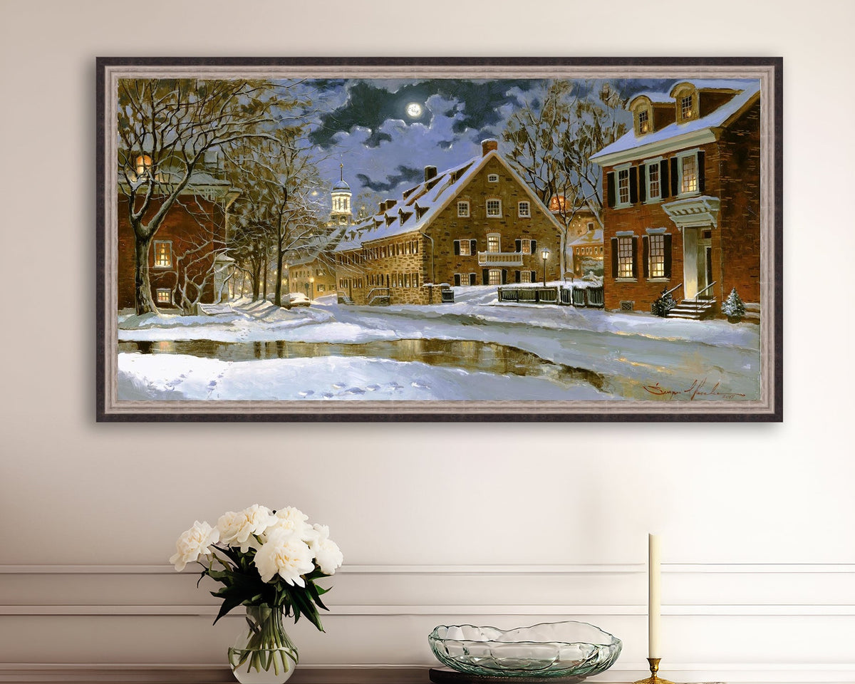 Snowy Bethlehem scene with Moravian Church at night.