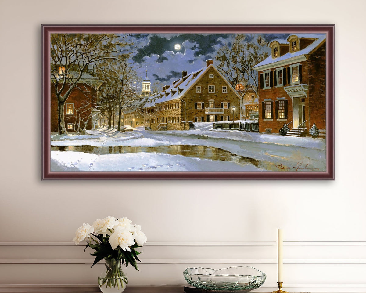 Snowy Bethlehem scene with Moravian Church at night.