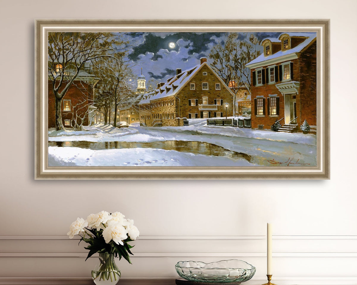 Snowy Bethlehem scene with Moravian Church at night.