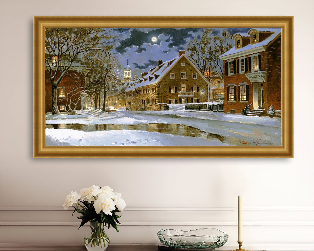 Snowy Bethlehem scene with Moravian Church at night.