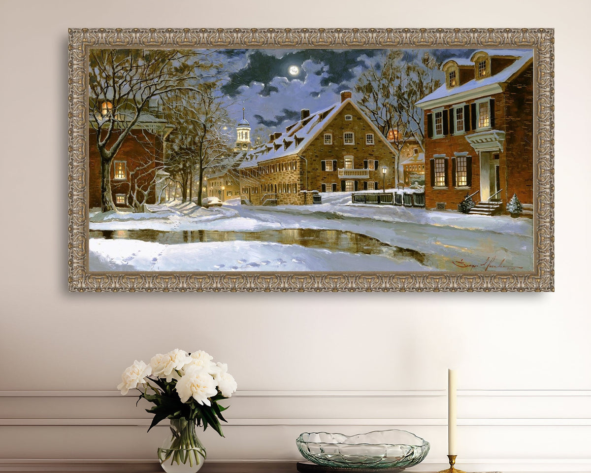 Snowy Bethlehem scene with Moravian Church at night.