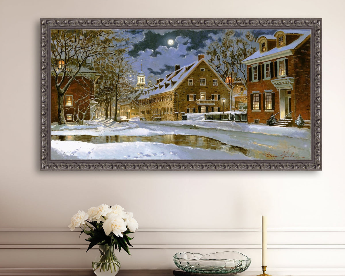 Snowy Bethlehem scene with Moravian Church at night.