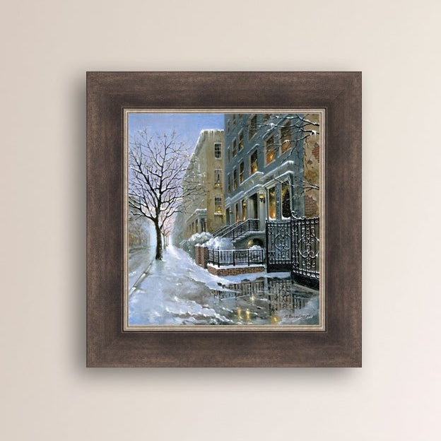 Framed artwork of snowy 82nd street in New York with a brownstone  building entrance and Christmas Tree in the window.