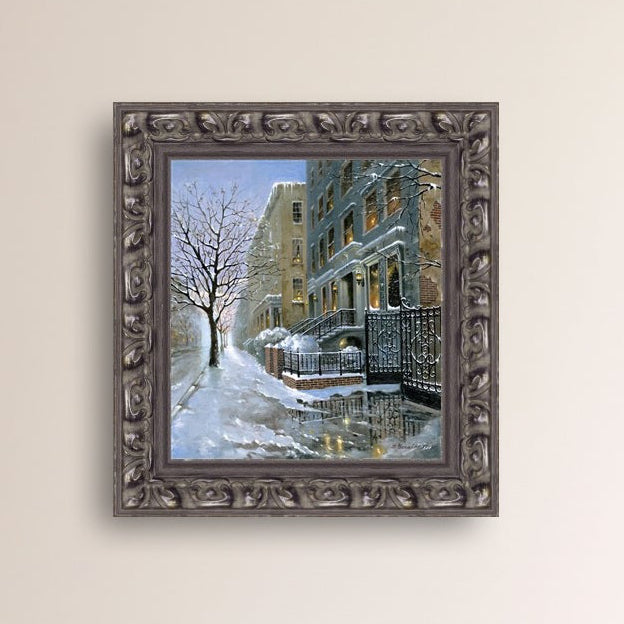 Snowy 82nd street in New York with a brownstone  building entrance and Christmas Tree in the window.