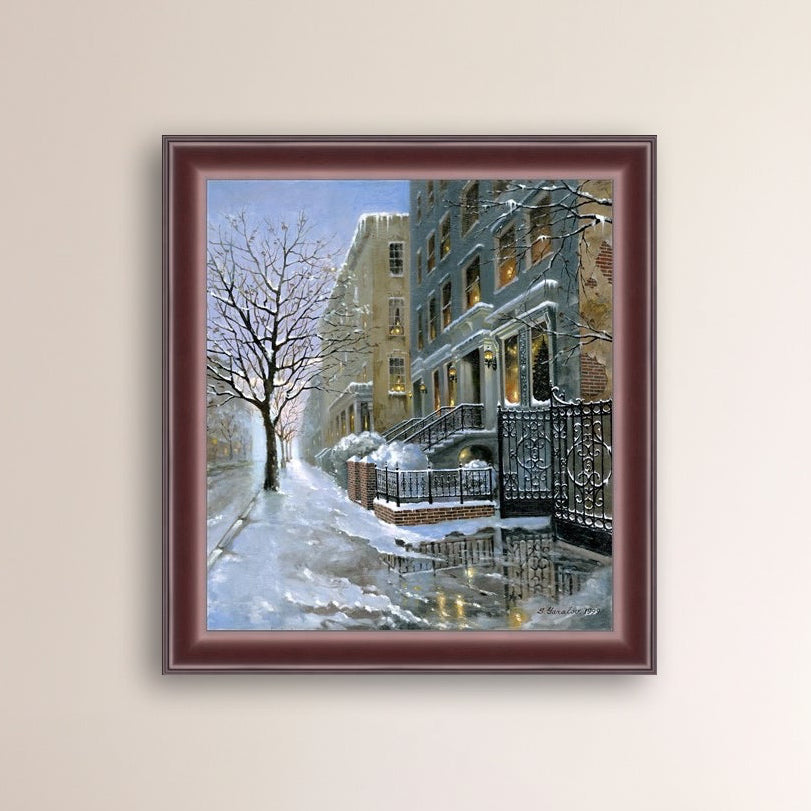 Framed artwork of snowy 82nd street in New York with a brownstone  building entrance and Christmas Tree in the window.