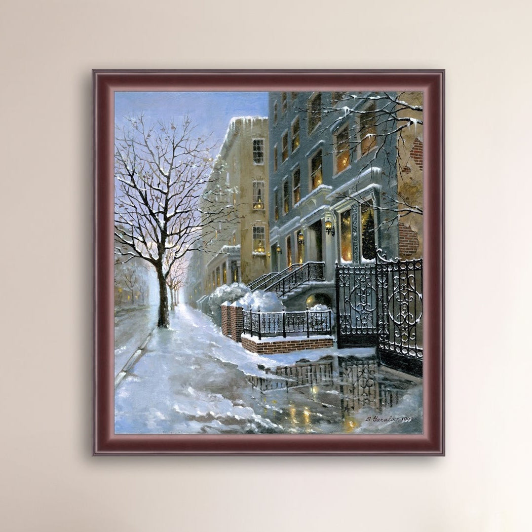 Framed artwork of snowy 82nd street in New York with a brownstone  building entrance and Christmas Tree in the window.