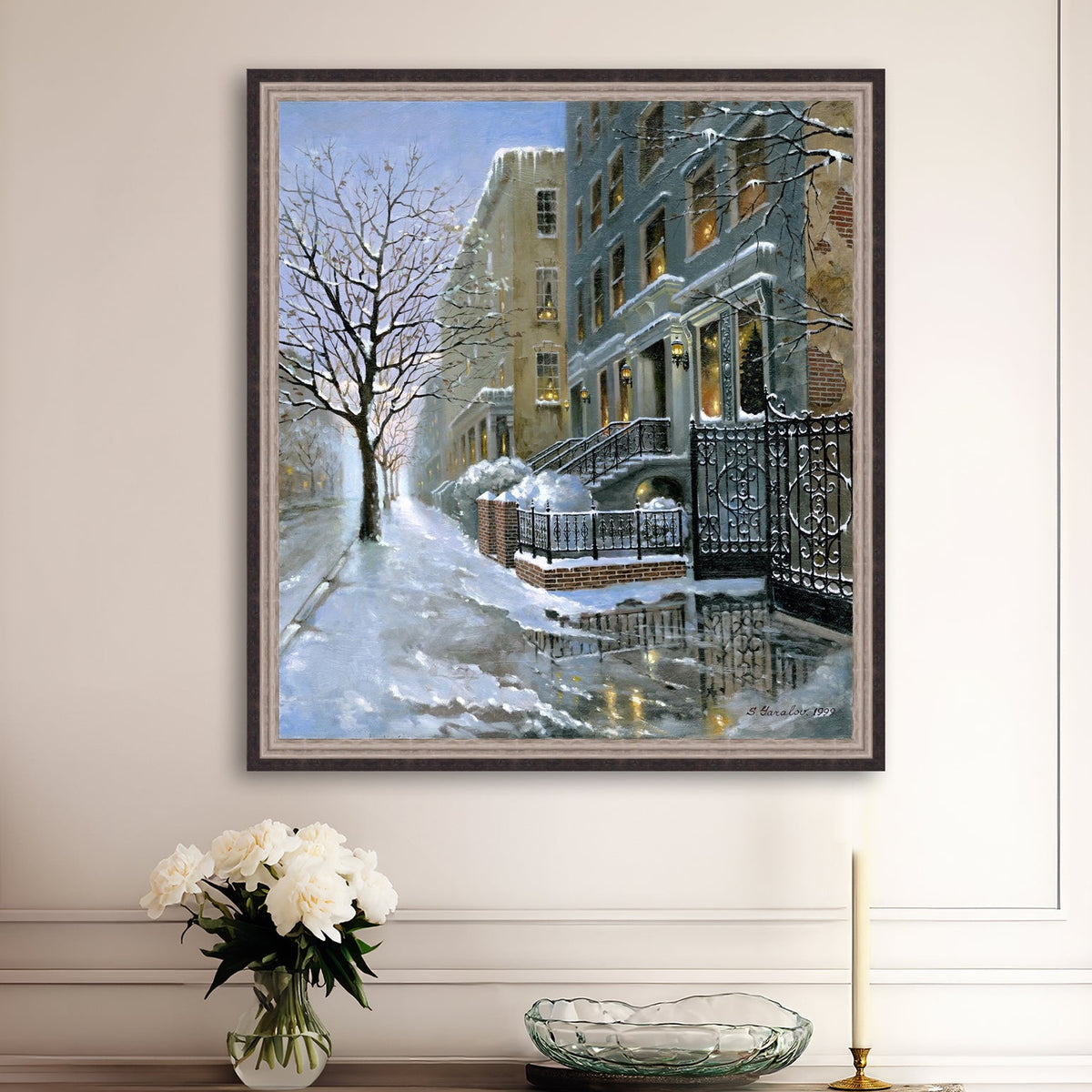 Framed artwork of snowy 82nd street in New York with a brownstone  building entrance and Christmas Tree in the window.