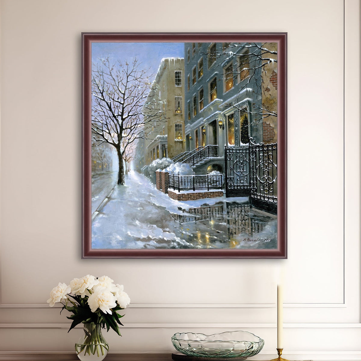 Framed artwork of snowy 82nd street in New York with a brownstone  building entrance and Christmas Tree in the window.
